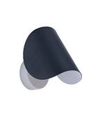 Angled view of a wall sconce with a curved black metal shade and a white circular backplate.