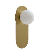 Milan wall sconce shown against a white background, featuring a slim brushed brass vertical backplate with an offset round white glass globe extending outward in a clean, modern silhouette.