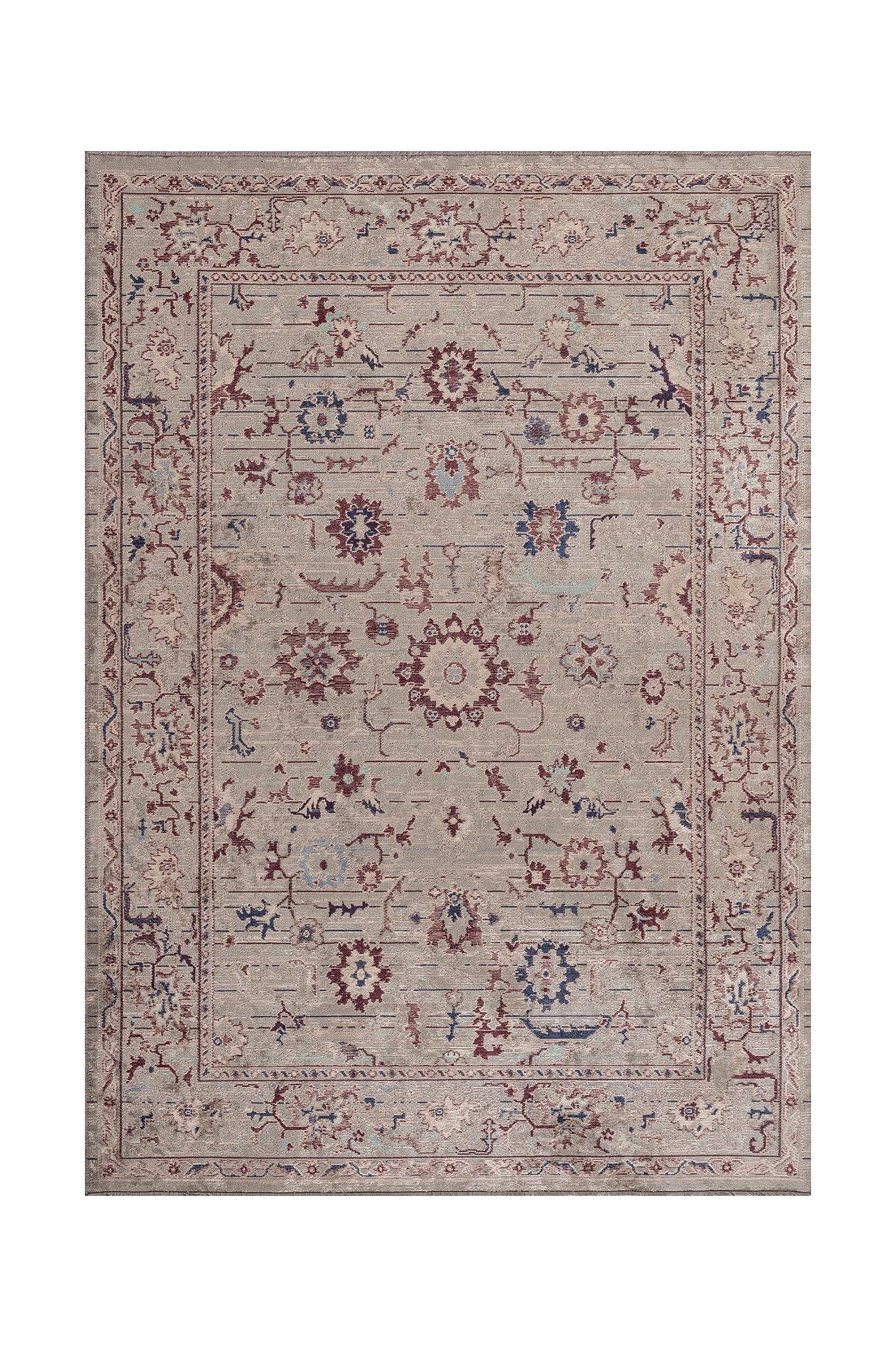 Traditional area rug with a central floral medallion and an ornate border in soft neutral and muted red-blue colors.