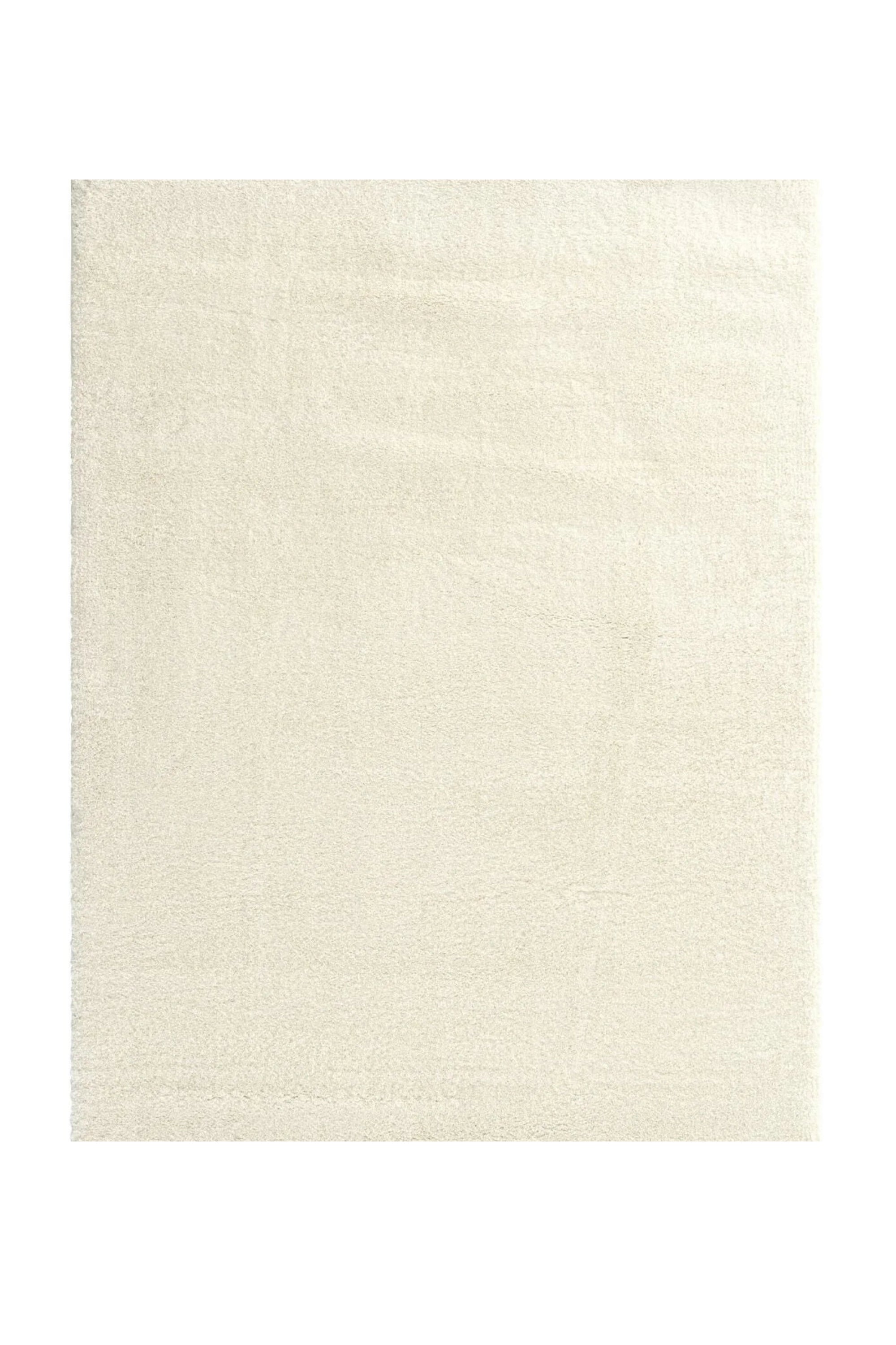 Beige rectangular handcrafted rug with a soft, smooth texture.