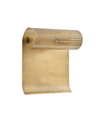 Wall-mounted antique brass light fixture with a perforated horizontal cylindrical shade above a flat rectangular backplate, illuminated against a textured wall.