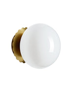 Wall-mounted light with a round opaque white glass globe and a brass backplate, shown from the front against a white background.