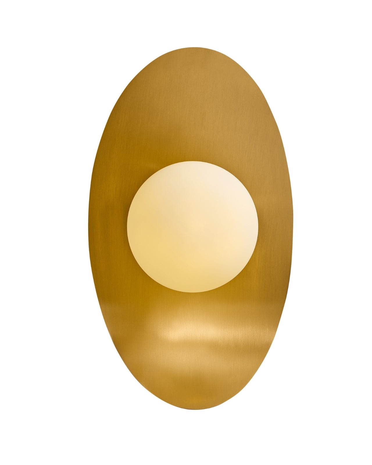 Wall-mounted light featuring a centered opaque white glass globe set against a vertically oriented oval brass backplate, shown on a white background.