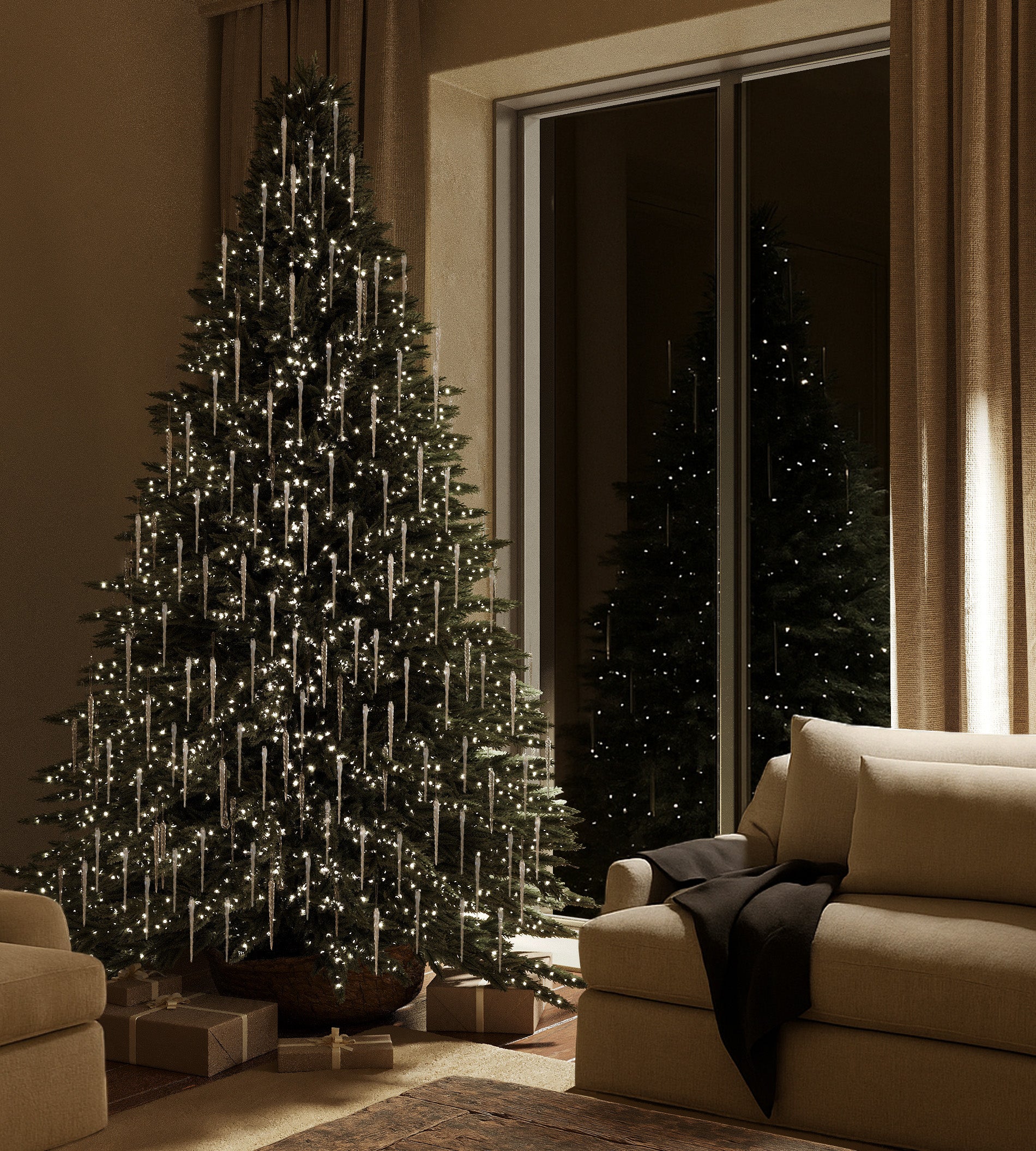 A Christmas tree decorated with clear glass icicle ornaments and warm white lights in a softly lit living room.