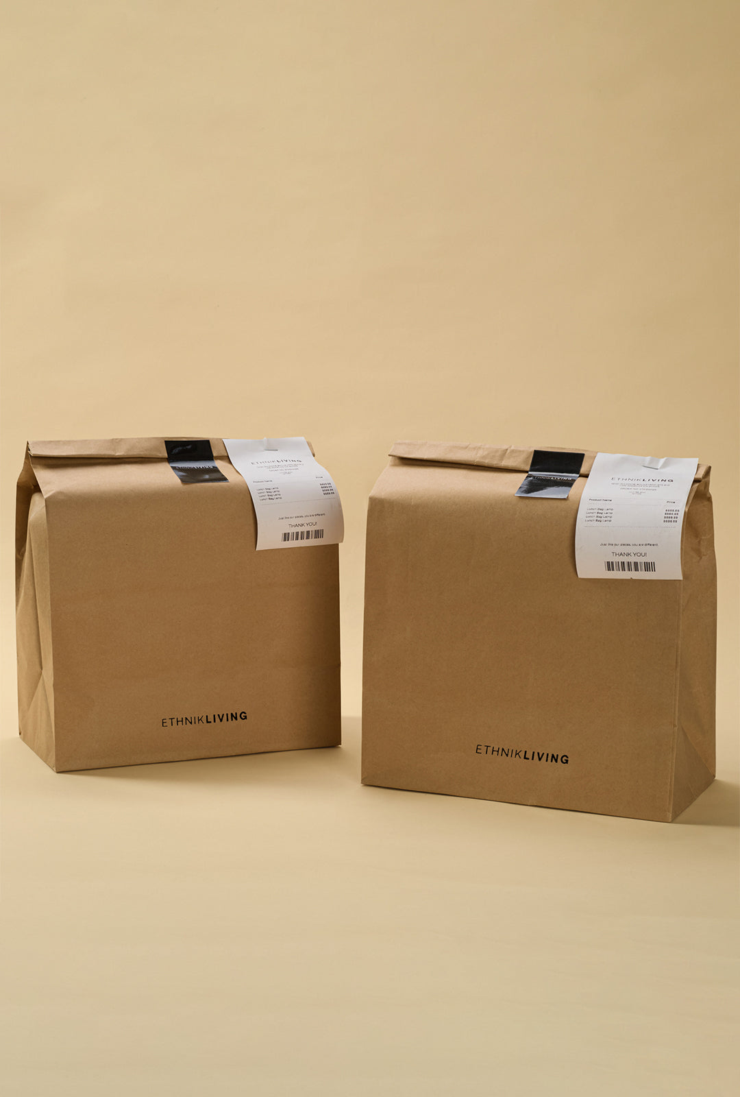 Brown paper packagings with “ETHNIKLIVING” logo and printed order label attached on top.