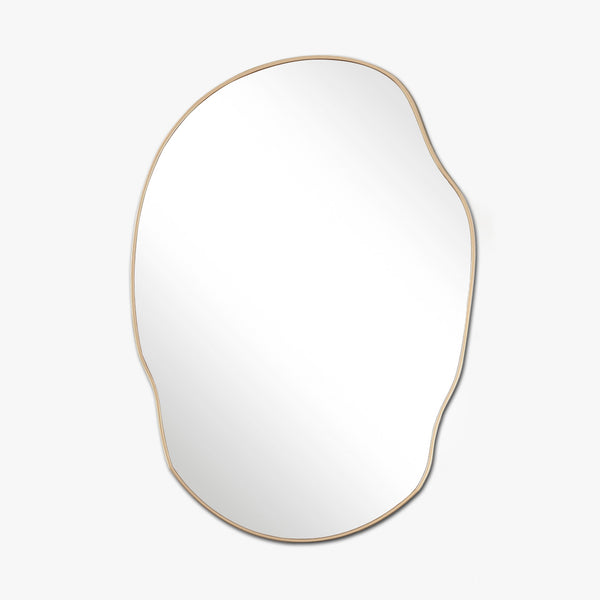 Irregular-shaped wall mirror with a thin brass-colored frame on a white background.