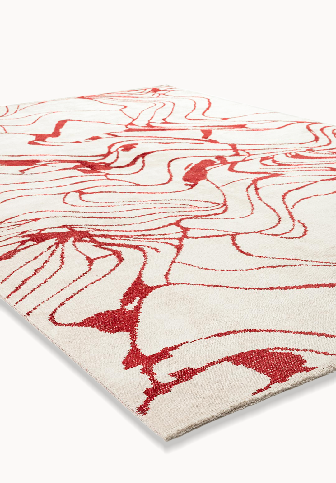 Angled view of a flat-woven area rug with flowing red abstract lines on a cream background.