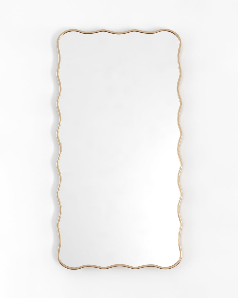 Rectangular full-length mirror with a gold frame and softly wavy edges, shown in a vertical orientation.