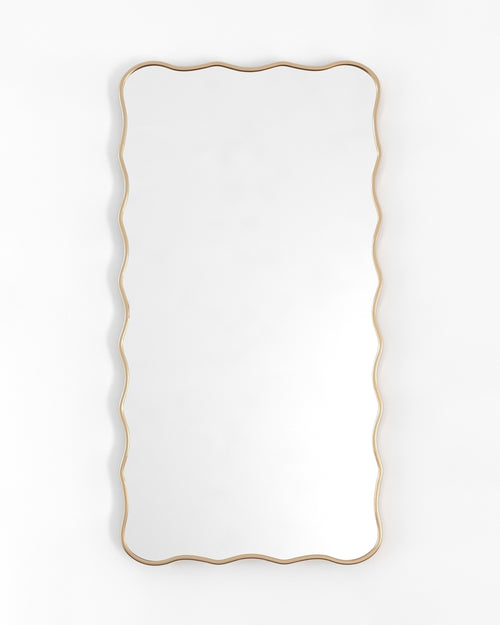 Rectangular full-length mirror with a gold frame and softly wavy edges, shown in a vertical orientation.
