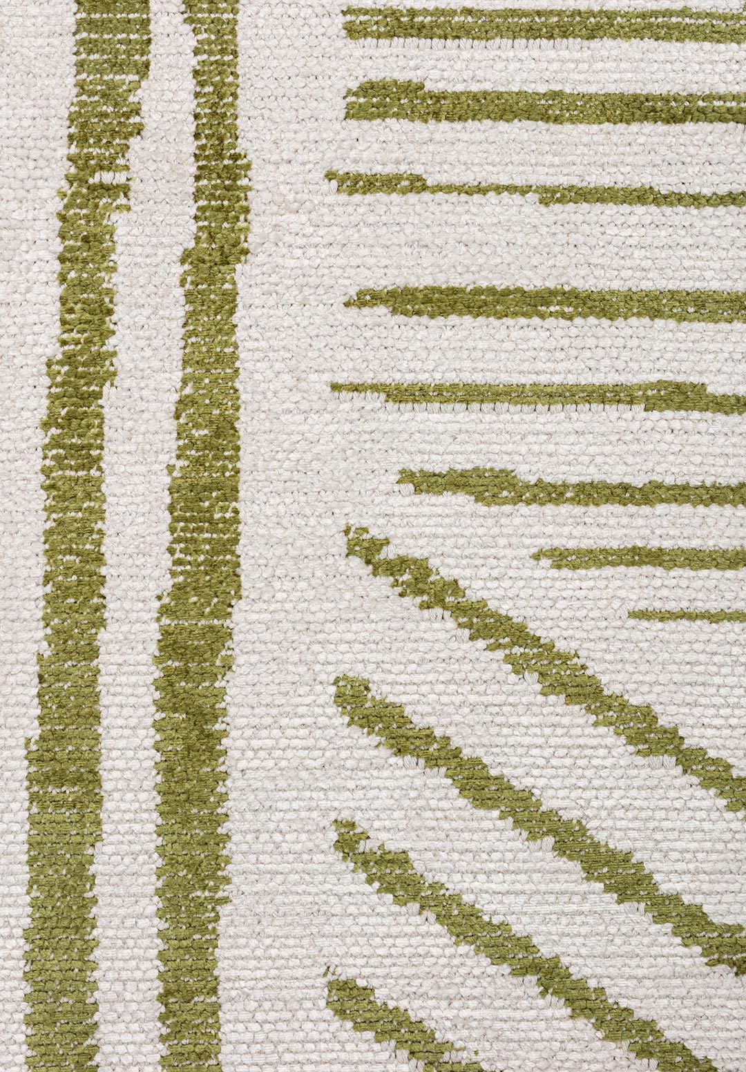 Close-up of a beige rug with green linear pattern.