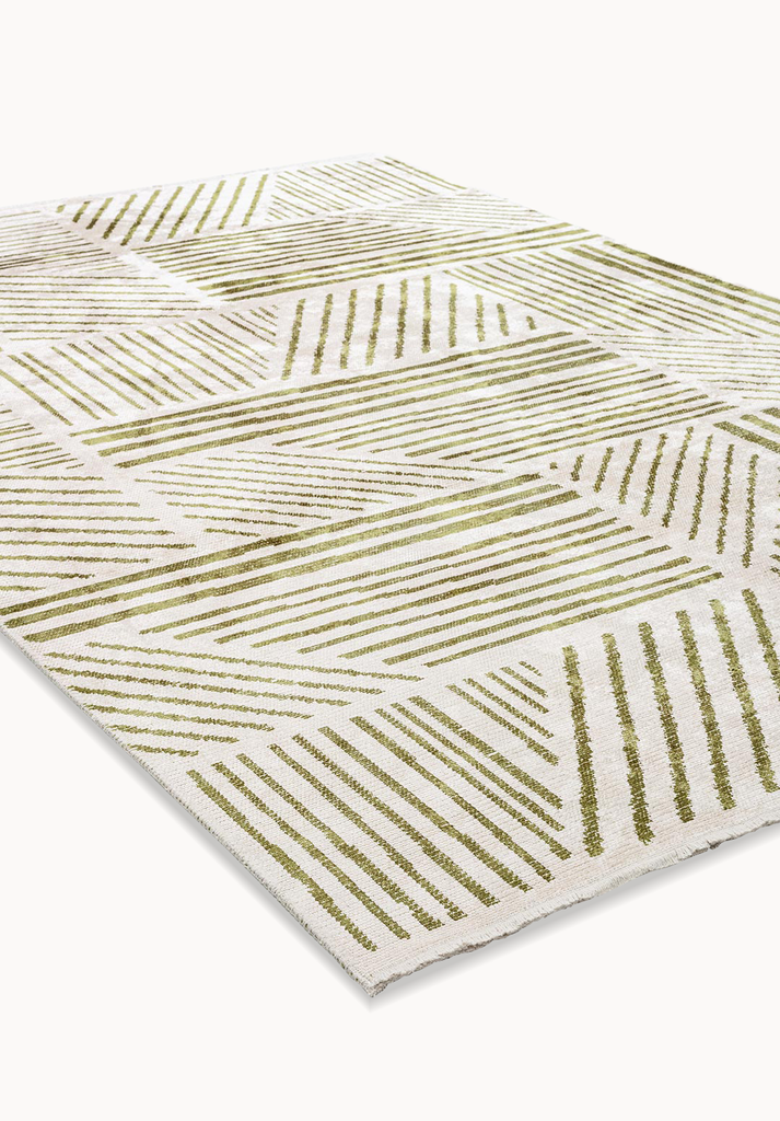 Angled view of a beige rug with green linear geometric pattern.